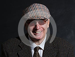 English gentleman in sunglasses and tweeds