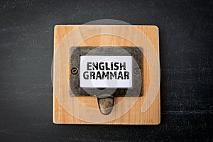 English Grammar. File cabinet label. Chalkboard background photo