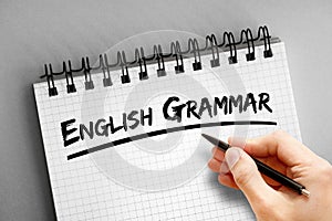 English grammar text on notepad, concept background