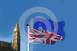 The English or Great Britain flag waving in front of a blurred EU European Union flag. Big Ben and Houses of Parliament seen in th