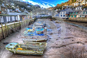 English harbour Polperro Cornwall South West England UK out of season in winter with boats at low tide