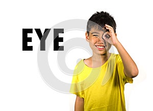 English language learning card with portrait of 8 years old child pointing his eye isolated on white background as part of school