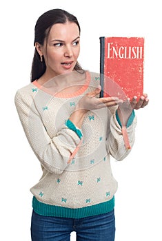 English language learning. Woman holding an English textbook