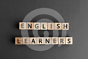 English learners - phrase from wooden blocks with letters photo