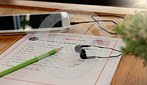 English listening test on wooden desk