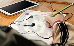 English listening test on wooden desk