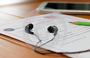 English listening test on wooden desk