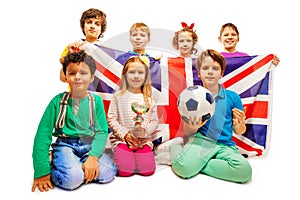 English little football winners with cup and ball