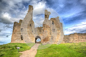 English medieval castle Dunstanburgh Northumberland England uk in hdr