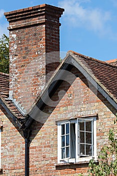 English period house close-up with white sash window and chimney