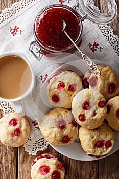 English sconces biscuits with red currants are served with tea a