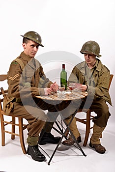 An English soldier and an American soldier playing cards photo