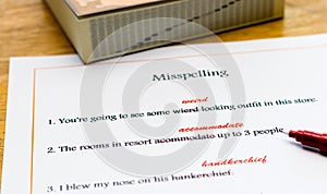 English spelling correction sheet on table