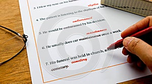 English spelling correction sheet on table