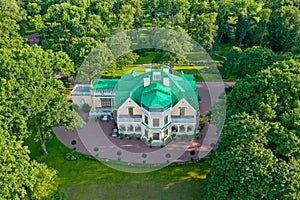 English-style cottage on a hill in Peterhof. Rural house in the park. Panoramic view from above