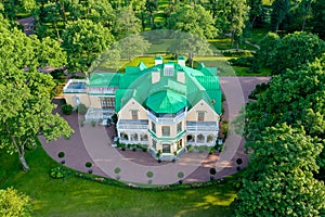 English-style cottage on a hill in Peterhof. Rural house in the park. Panoramic view from above