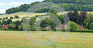 An English Summer Landscape with a Village in the Valley