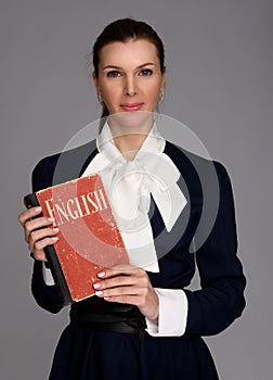 English teacher holding a textbook