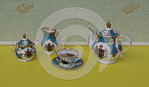 English teacup with saucer, teapot, sugar bowl and cream jug, fine bone china porcelain