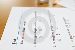 English test and answer sheet on table