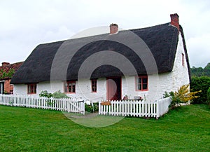 English thatched white cottage