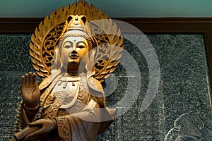 The engrave of gold wooden Guan Yin