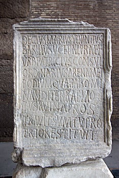 Engraved stone in Coliseum with latin letters