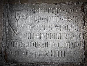 Engraved stone with latin letters