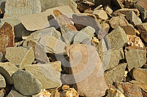 Engraved stones with Tibetan Buddhist mantra in a village of Padum, Zanskar Valley, Ladakh, INDIA