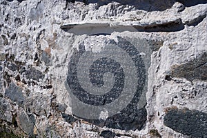 engraved Tibetan text in wall