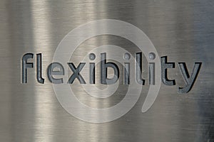 Engraving a cnc machine on a piece of metal. Engraving flexibility text
