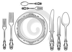 Engraving cutlery and dinner plates photo