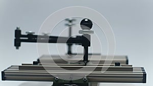 Engraving device pantograph rotating on white background