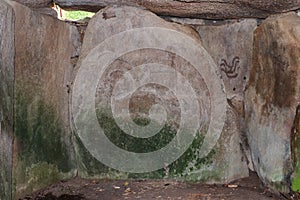 Engravings on stones in the tumulus Mane Lud near Locmariaqur in Brittany, France