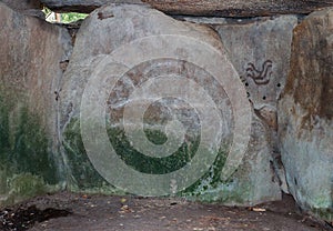 Engravings on stones in the tumulus Mane Lud near Locmariaqur in Brittany, France