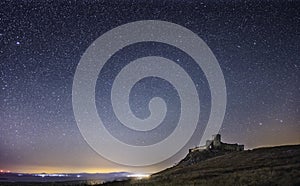 Enisala fortress by night, starry sky, visible Milky Way galaxy, clear sky, long exposure