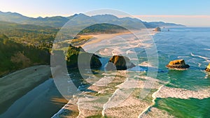 Enjoy aerial footage with camera tilt down, gradually up & flying over Ecola State Park Viewpoint. See sandy shores, waves & Orego