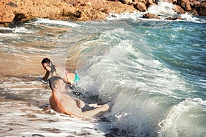 Enjoy the beach, enjoy the waves, couple enjoy and have fun on the beach, couple enjoying in sea waves