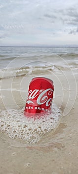 Enjoy a Coca Cola drink on Laskar Pelangi Beach