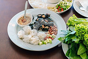 Enjoy eat with Vietnamese Meatball Wraps Nam-Neung, Pork Sausage wraps with fresh vegetables in rice paper, generous platter eat