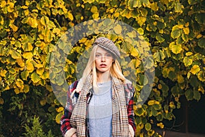 Enjoy fall season. Autumn is here. Fashion trend. Pretty woman in hat. Fancy girl. Woman wear checkered clothes nature