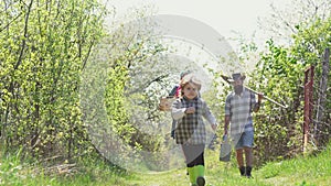 Enjoy in farm. Happy family. Dad mom and son playing together. Eco farm for family. Family farmer concept - spring time