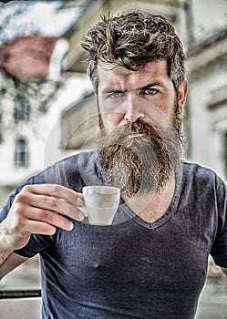 Enjoy hot drink. Hipster drinking fresh brewed coffee. Bearded guy consume caffeine. Espresso arabica only. Coffee break