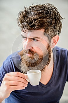 Enjoy hot drink. Hipster drinking fresh brewed coffee. Man with beard and mustache and espresso cup. Bearded guy consume