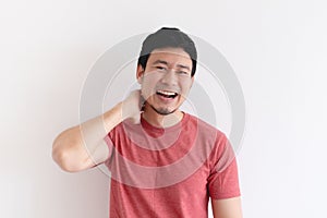 Enjoy and laughing face of man in red t-shirt on isolated background.