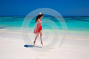 Enjoy life. Beautiful girl jumping running on exotic beach with
