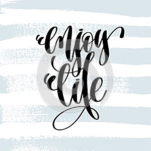 Enjoy life - hand lettering inscription on blue brush stroke