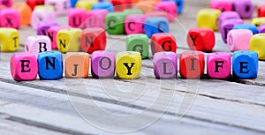 Enjoy life words on table