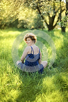 Enjoy Nature. Healthy Smiling Girl in the Spring Park. Sunny day. Vertical outdoor portrait of beautiful young 30 years old woman