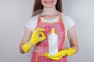 Enjoy new product form checked company concept. Cropped close up photo of beautiful girl holding bottle with dispenser in hands